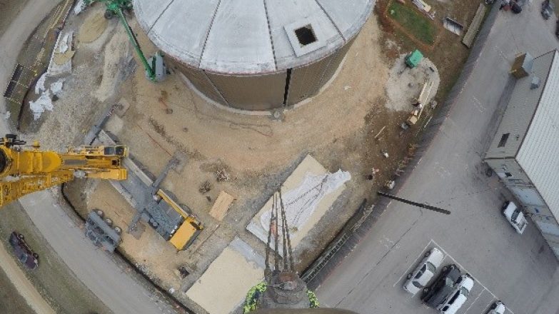 An aerial view of a construction site with a crane.
